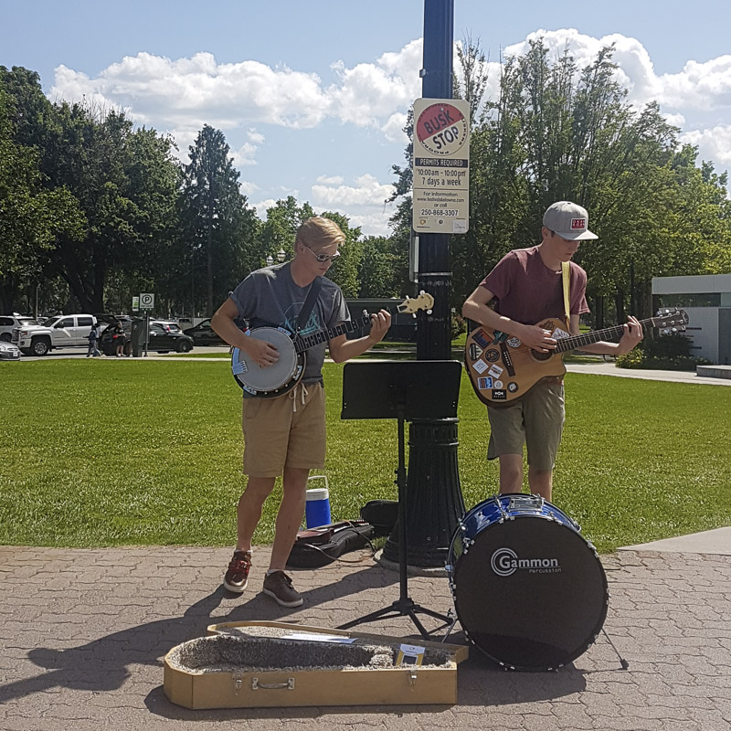 Musician performing at sunset in Kelowna for Parks Alive!